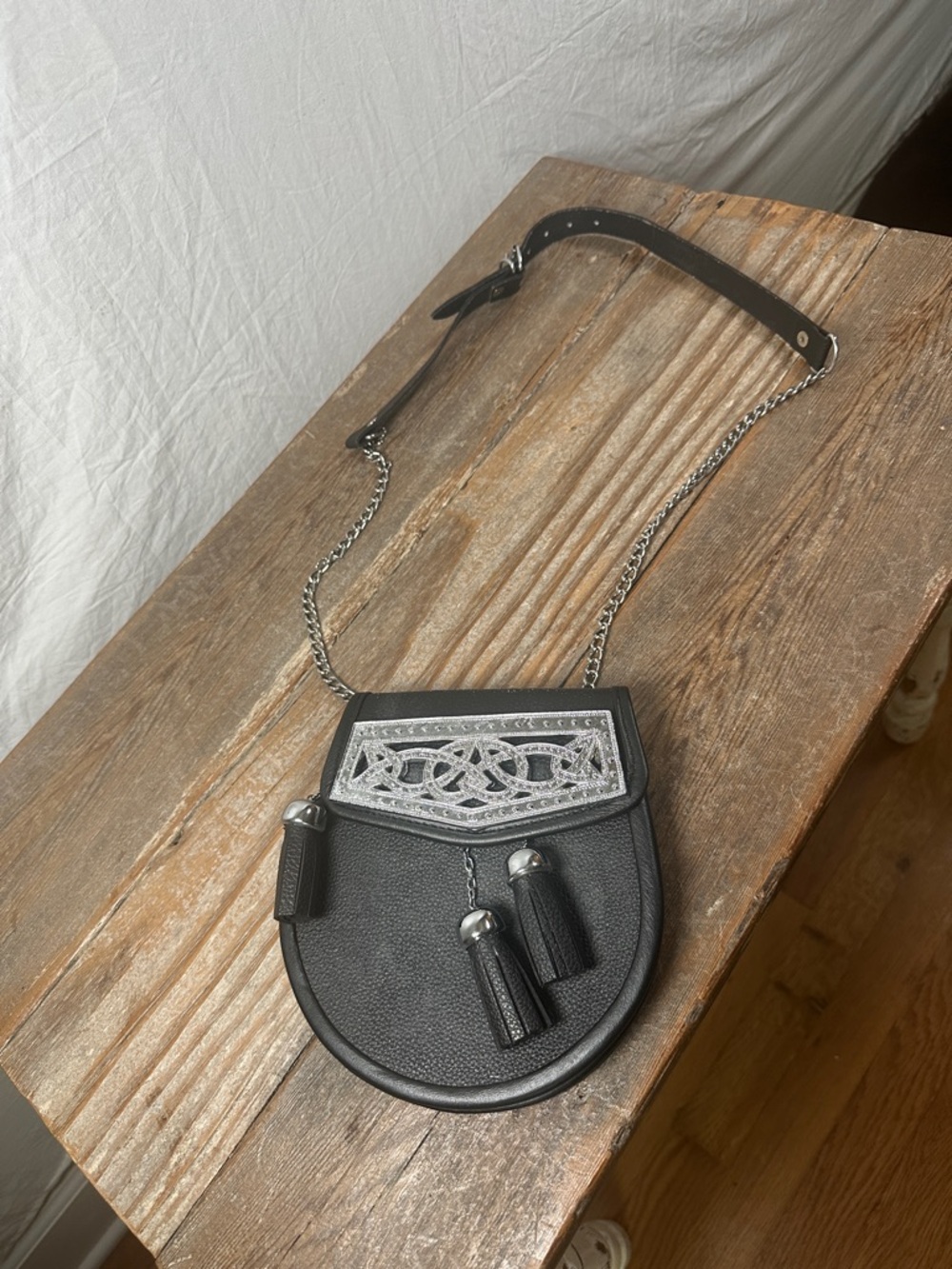 Black Leather Tassel Chain Crossbody Bag with Metallic Accent